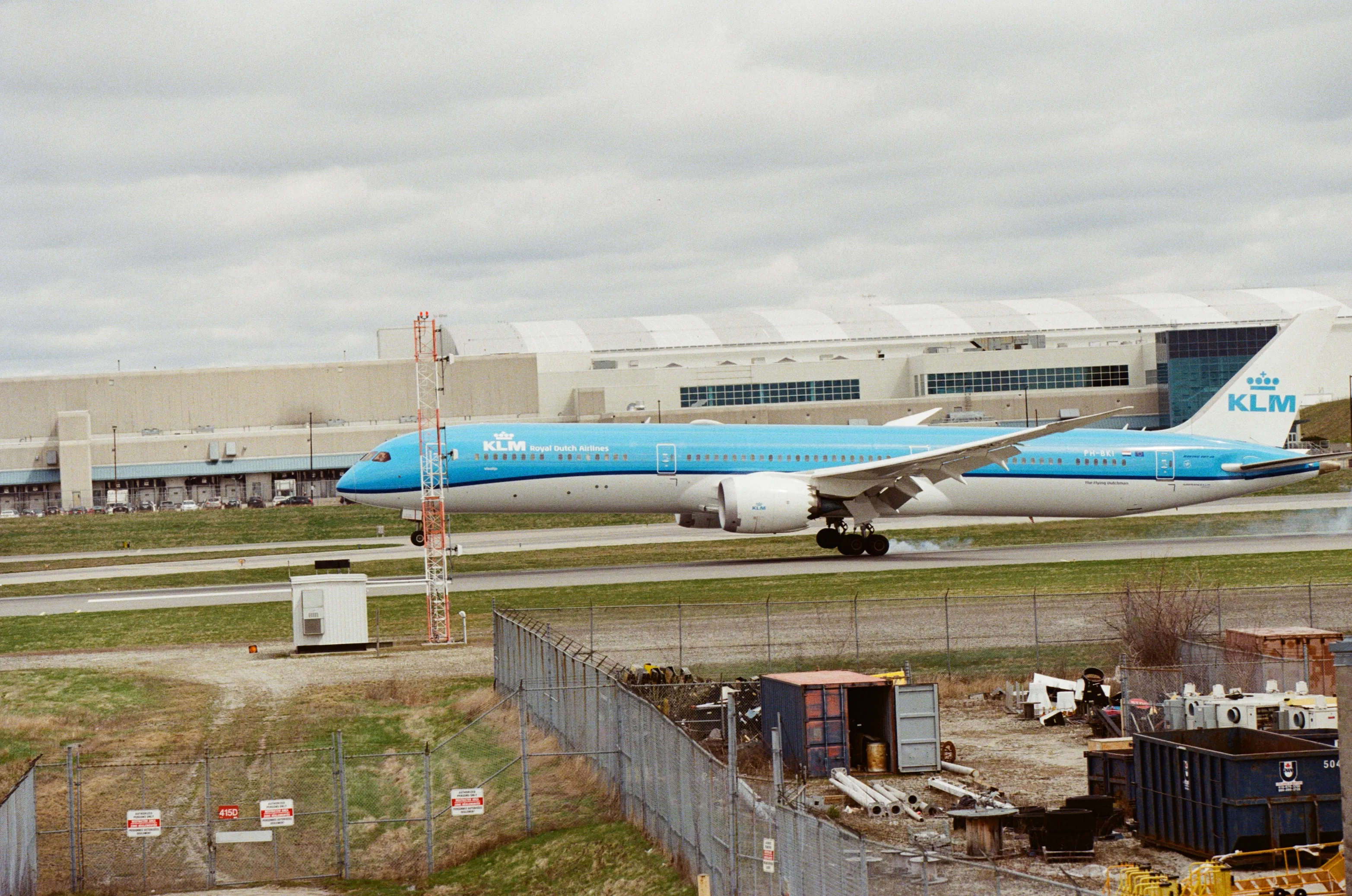 KLM 787 with tire smoke touching down