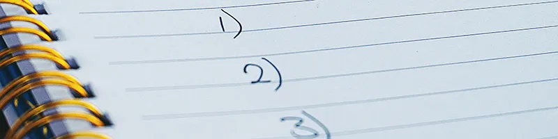 Lined paper with numbers 1 to 4 written